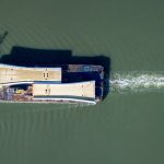 Aerial view of the GPS Avenger tugboat towing a barge carrying bridge spans for Waterford’s Sustainable Transport Bridge.