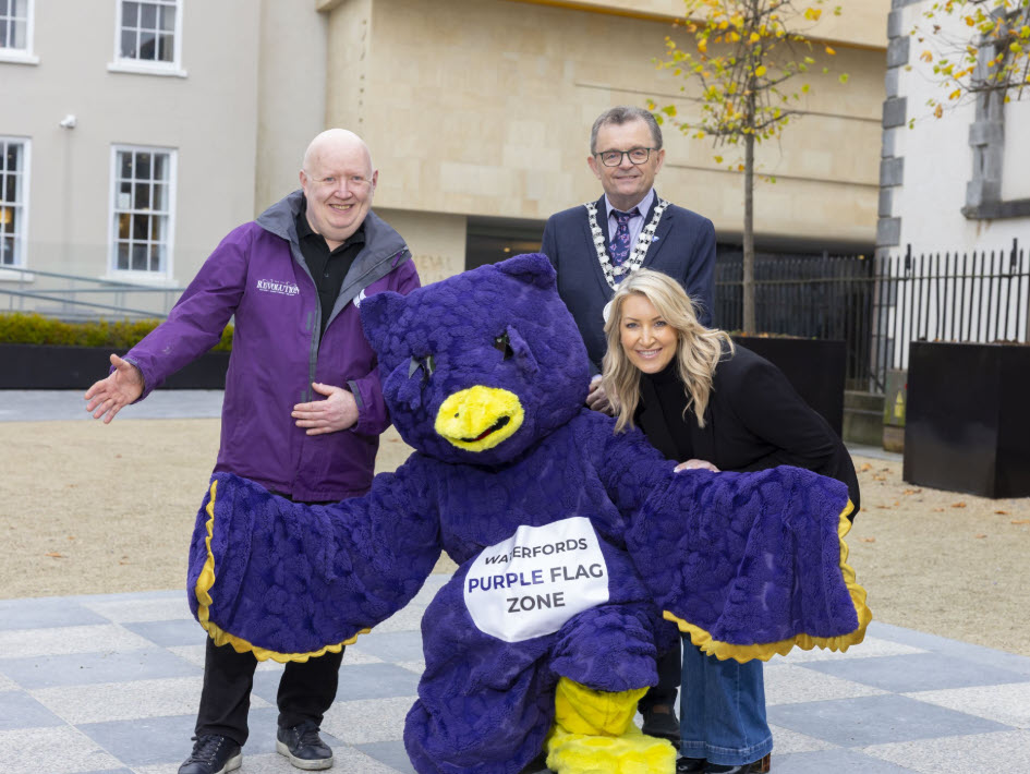 Mayor of Waterford City and County, Cllr. Seamus Ryan and Purple Flag mascot, ‘Hoot’ with Jim ‘Flash’ Gordan Revolution and Chair of the Purple Flag Committee and Julie Walsh Purple Flag Administrator with Waterford City and County Council.